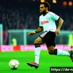 제이제 오코차 전설적인 선수 - A dynamic, detailed scene of Jay-Jay Okocha skillfully dribbling past multiple defenders in a packed...